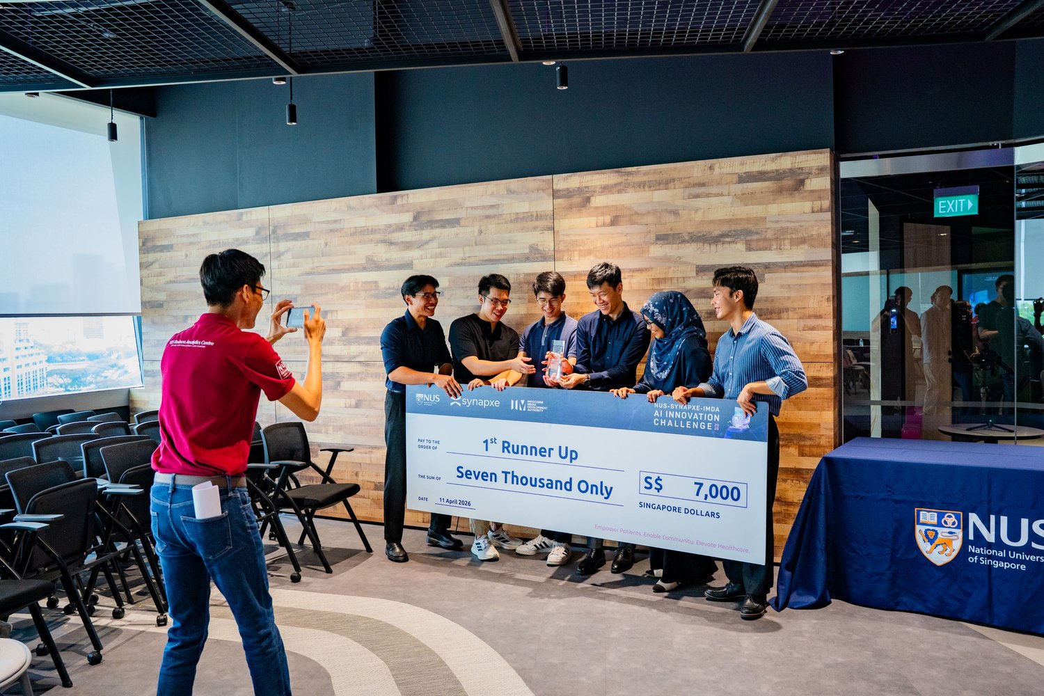 The team with the winner's cheque at the AI Innovation Challenge 2026 finals